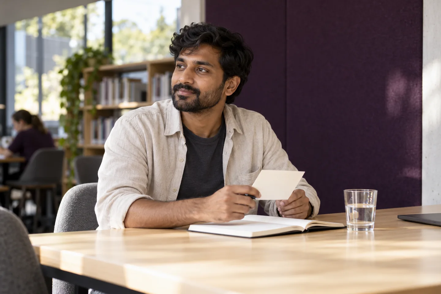 An adult preparing personal notes before a professional conversation